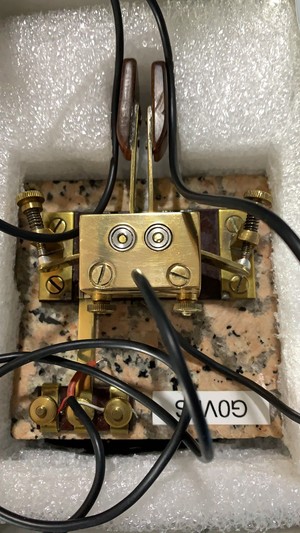 A home made iambic more key. The base is marble and the key is brass. 