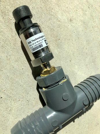SSI pressure sensor screwed into a plastic tee fitting