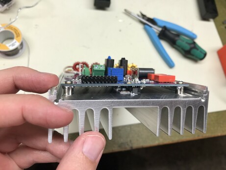 View from the side. You can see the mosfets sitting on the heatsink