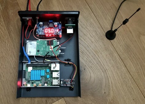 My Allstarlink node sitting on the floor showing its guts