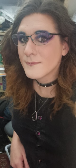 Selfie with purple and blue eye shadow.