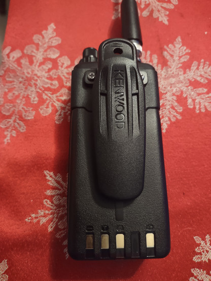 Kenwood TH-D75 handheld radio with KBH-11 belt clip made for Kenwood's commercial handheld radios. Top view.