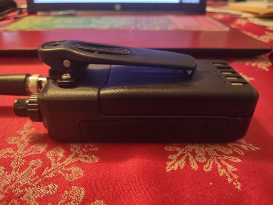 Kenwood TH-D75 handheld radio with KBH-11 belt clip made for Kenwood's commercial handheld radios. Side view.