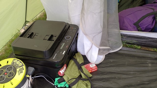A multi function printer in a tent