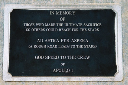 A plaque affixed to the concrete structure  at space launch complex 34 Cape Canaveral Space Force Station. It reads: In memory of those who made the ultimate sacrifice so others could reach for the stars Ad Astra Per Aspera (a rough road leads to the stars) God Speed to the Crew of Apollo 1