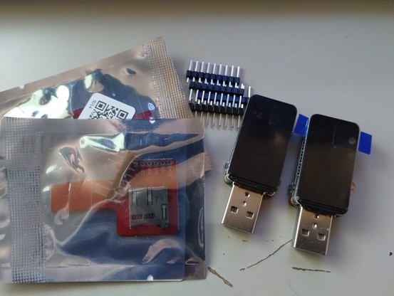 2 waveshare ESP32-S3 USB boards with 1.47 inch LCD, kind of neat boards, the display is kind of an oval, also pictured two micro SD card breakout boards brand new in packing, and pin headers for the boards