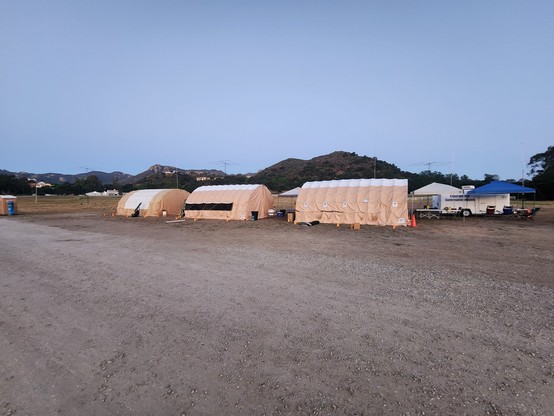 Collapsible Quonset-style tents and Thousand Oaks Emergency Communications trailer being used by Conejo Valley Amateur Radio Club #2025FieldDay