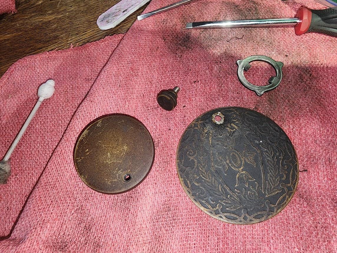 Filthy parts from a 1911 Singer sewing machine